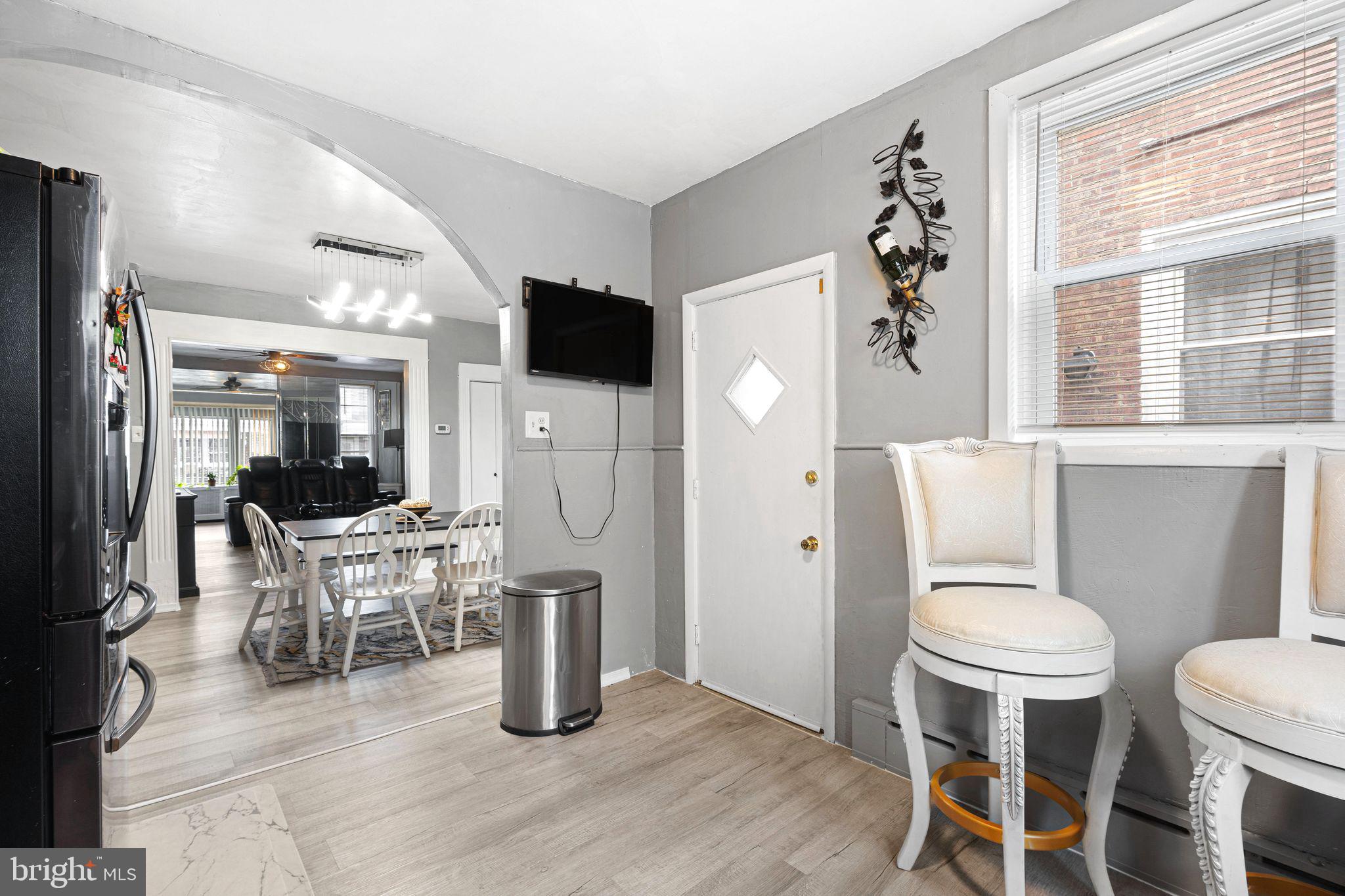 5431 Akron Street Philadelphia, PA 19124 - Photo 12 of 32 a living room with furniture a window and a fireplace