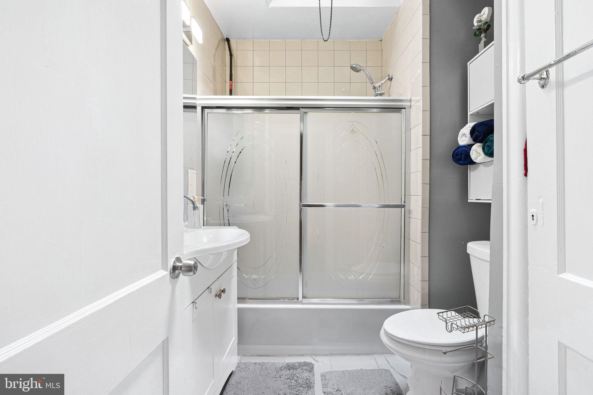 5431 Akron Street Philadelphia, PA 19124 - Photo 18 of 32 a bathroom with a toilet and a shower