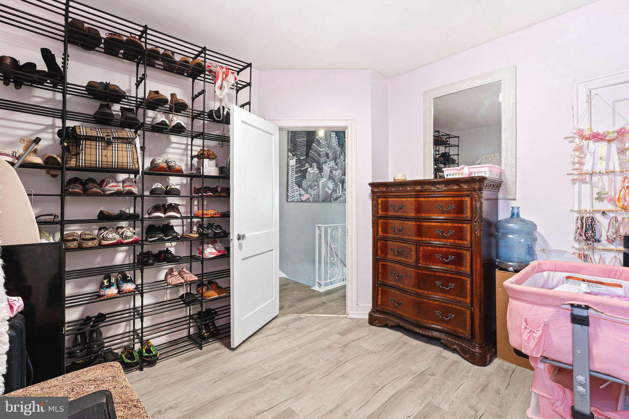5431 Akron Street Philadelphia, PA 19124 - Photo 23 of 32 a view of walk in closet with clothes and shoes
