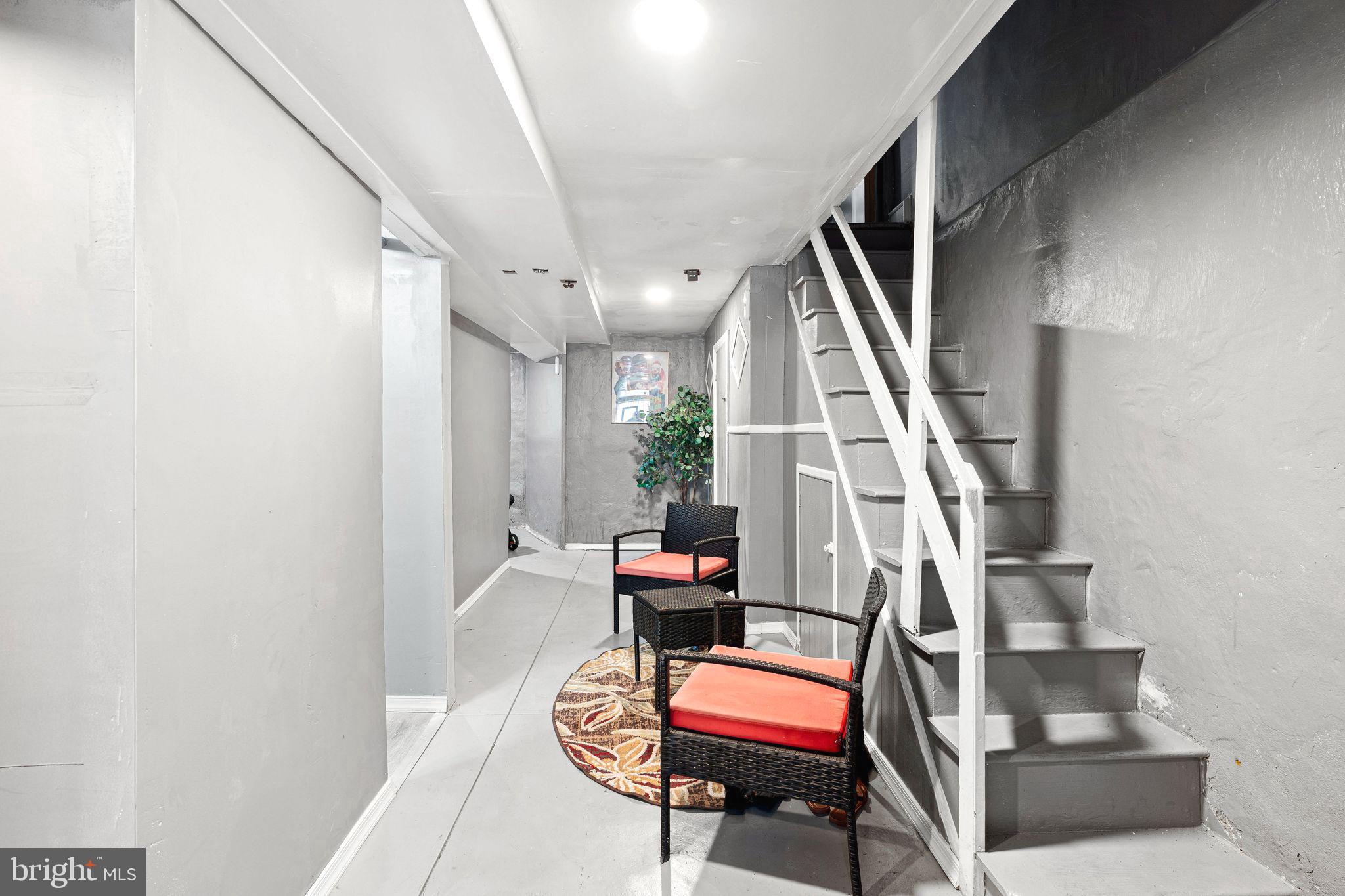 5431 Akron Street Philadelphia, PA 19124 - Photo 24 of 32 a room with stairs and wooden floor