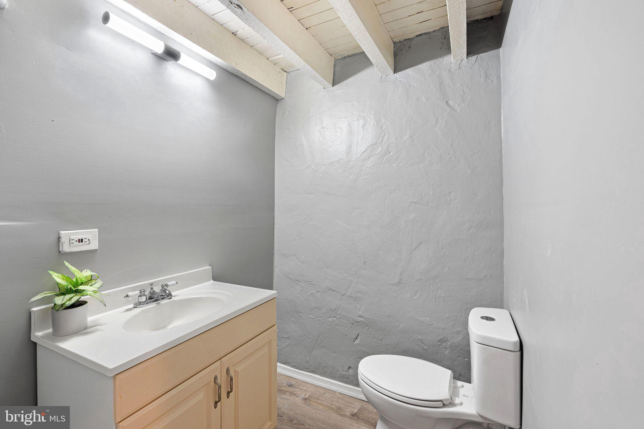 5431 Akron Street Philadelphia, PA 19124 - Photo 26 of 32 a bathroom with a sink toilet and vanity