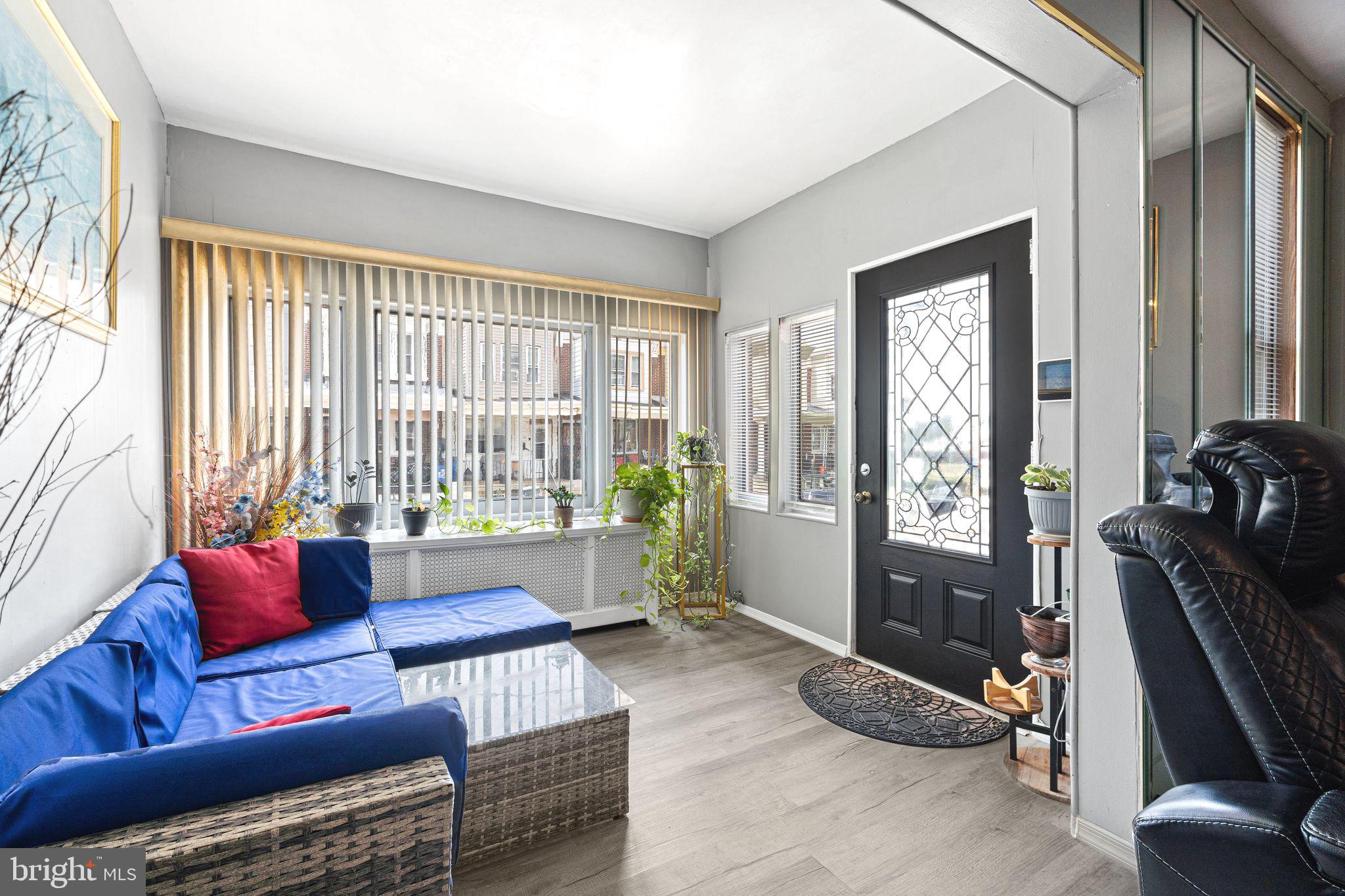 5431 Akron Street Philadelphia, PA 19124 - Photo 3 of 32 a living room with furniture and a floor to ceiling window