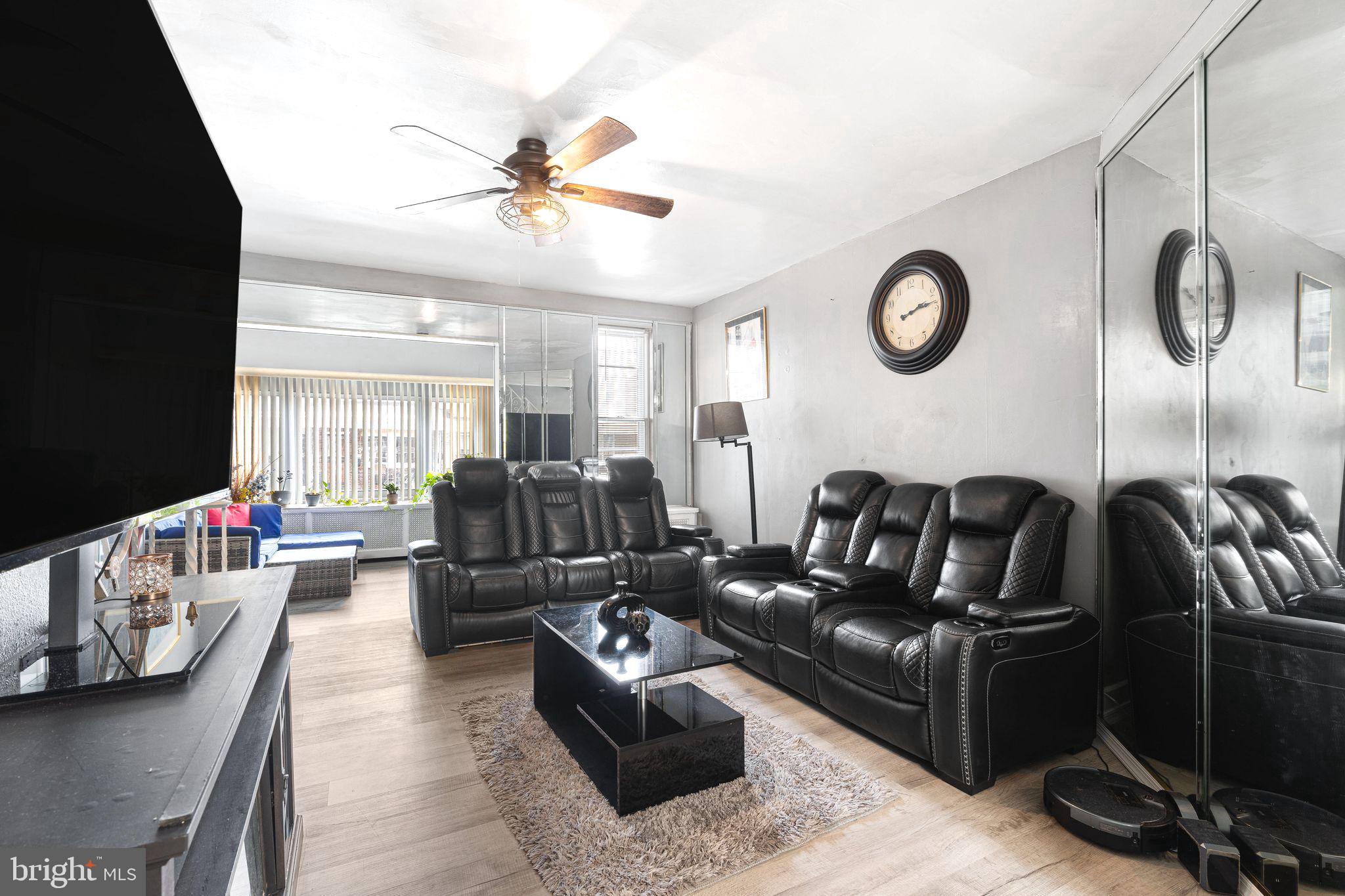 5431 Akron Street Philadelphia, PA 19124 - Photo 7 of 32 a living room with furniture kitchen view and a wooden floor