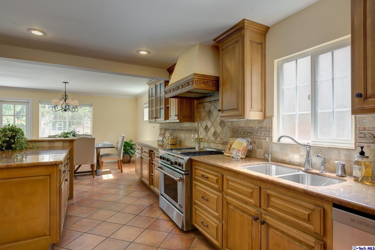 804 Milan Avenue South Pasadena, CA 91030 - Photo 21 of 58 a kitchen with stainless steel appliances a sink stove and cabinets