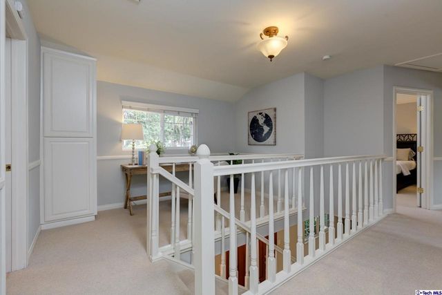 a bedroom with a bed and a fireplace