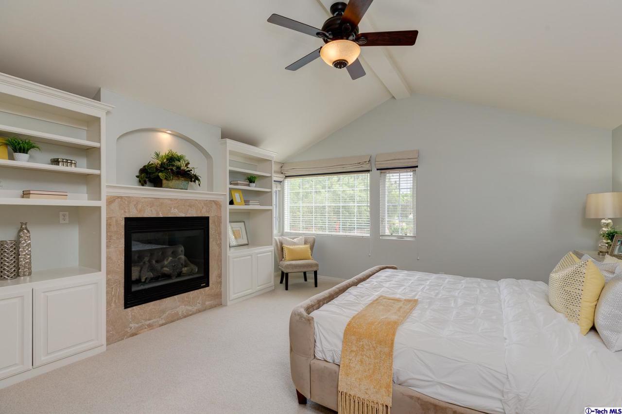 804 Milan Avenue South Pasadena, CA 91030 - Photo 30 of 58 a bedroom with a bed and a fireplace