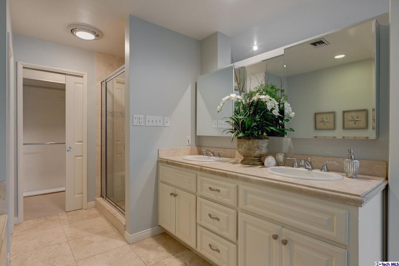 804 Milan Avenue South Pasadena, CA 91030 - Photo 33 of 58 a bathroom with a double vanity sink and a mirror