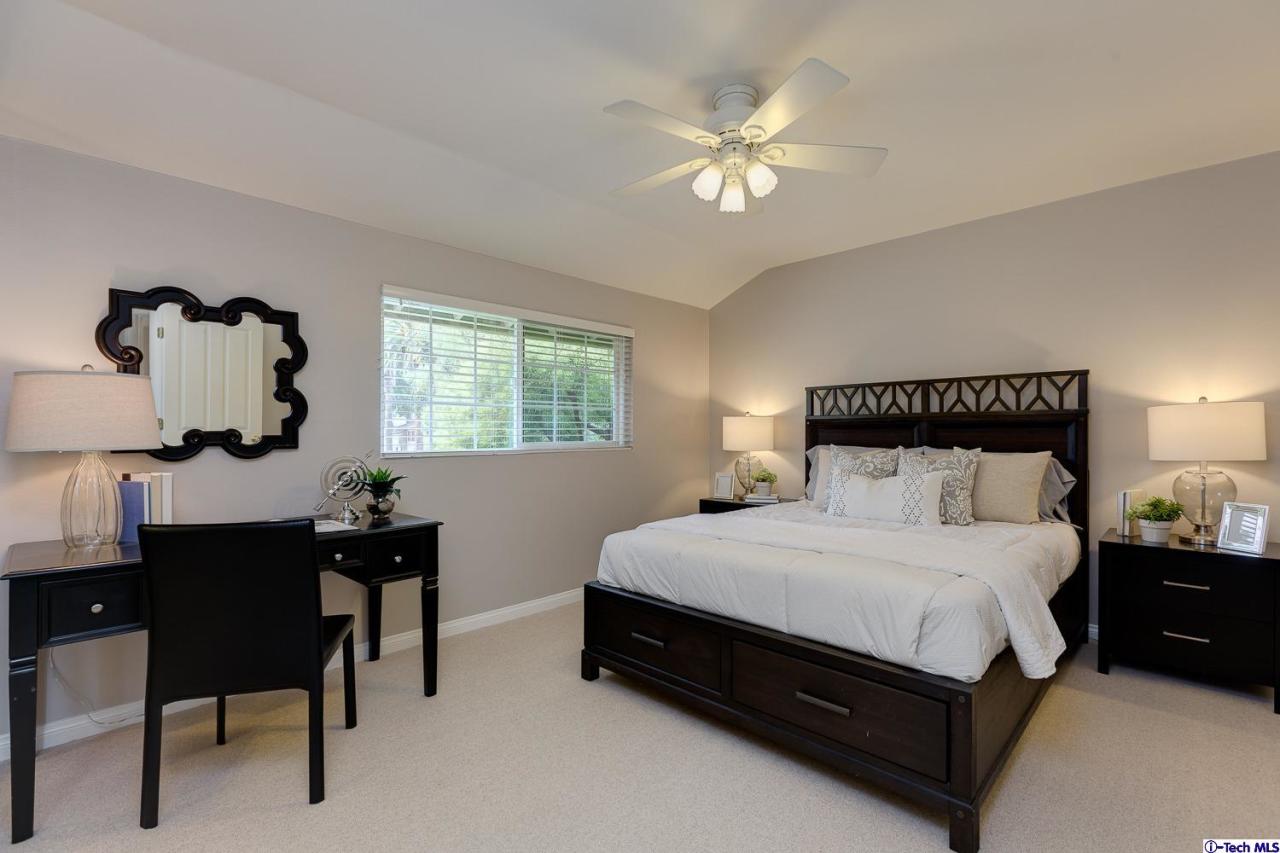 804 Milan Avenue South Pasadena, CA 91030 - Photo 35 of 58 a bedroom with a bed table chair and a window
