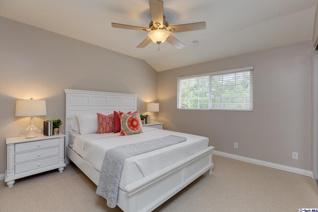 804 Milan Avenue South Pasadena, CA 91030 - Photo 36 of 58 a bedroom with a bed a chandelier and a window