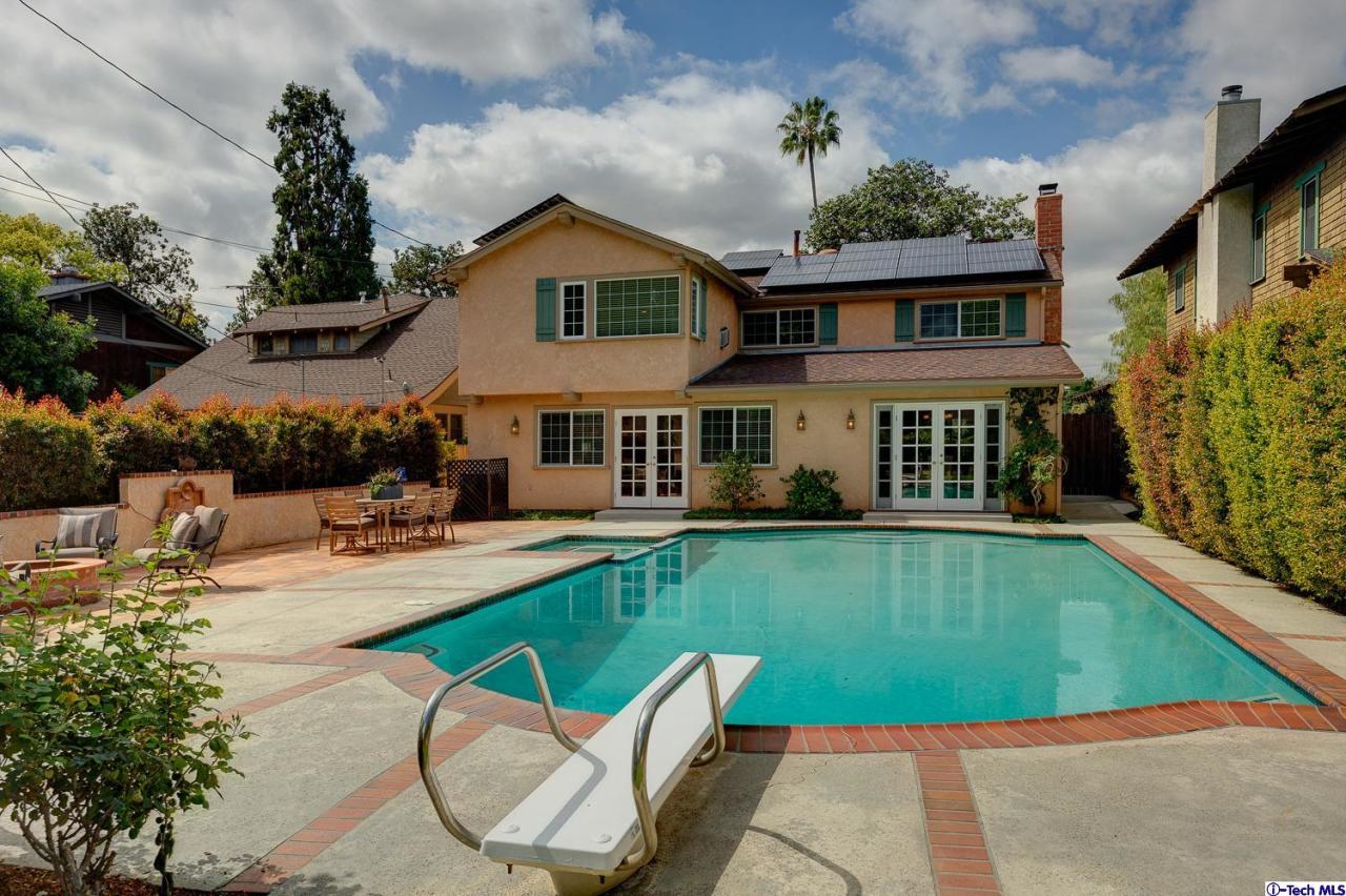 804 Milan Avenue South Pasadena, CA 91030 - Photo 41 of 58 a view of a house with swimming pool lawn chairs and a yard