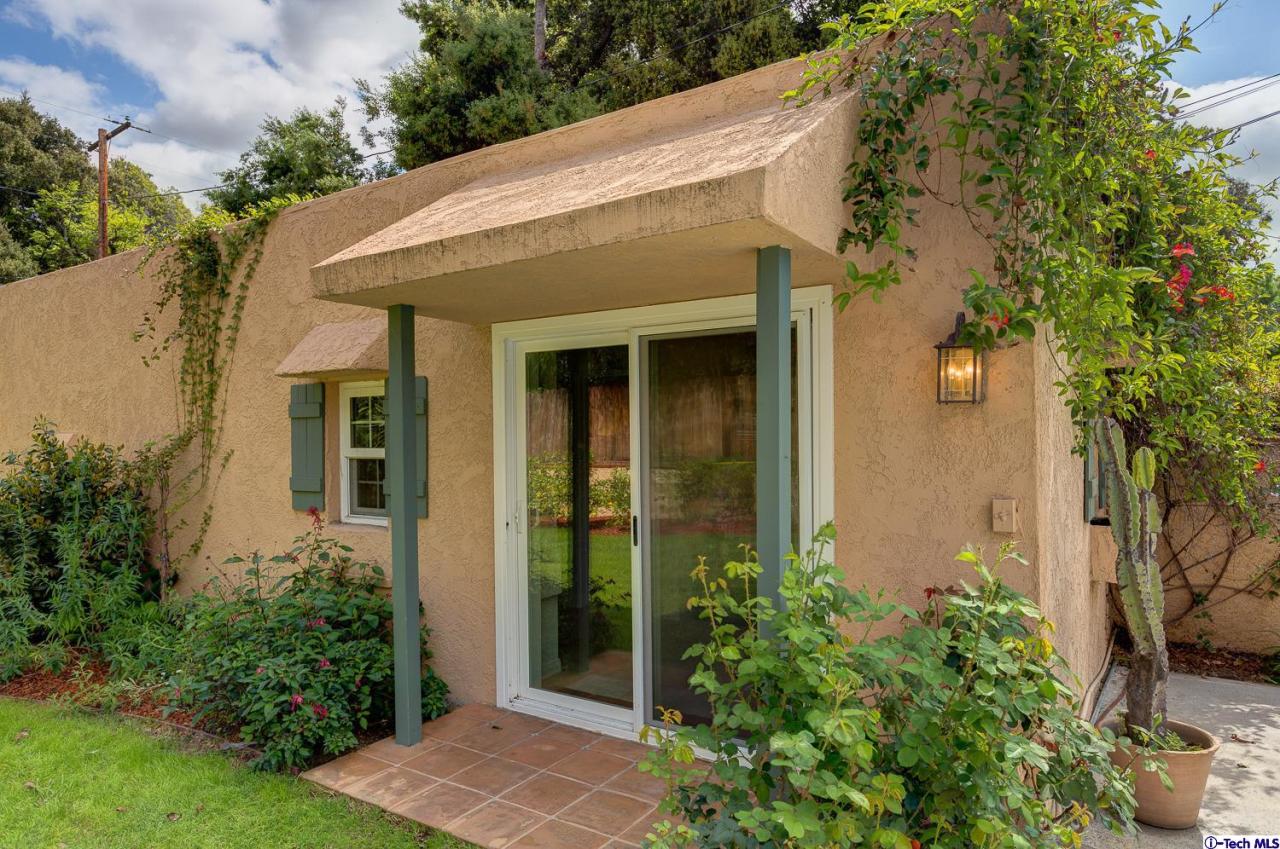 804 Milan Avenue South Pasadena, CA 91030 - Photo 46 of 58 a view of a house with potted plants and a table and chair