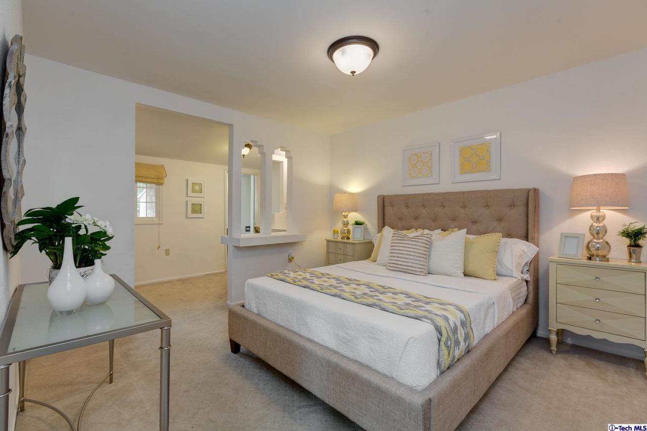 804 Milan Avenue South Pasadena, CA 91030 - Photo 52 of 58 a bedroom with a bed and a potted plant