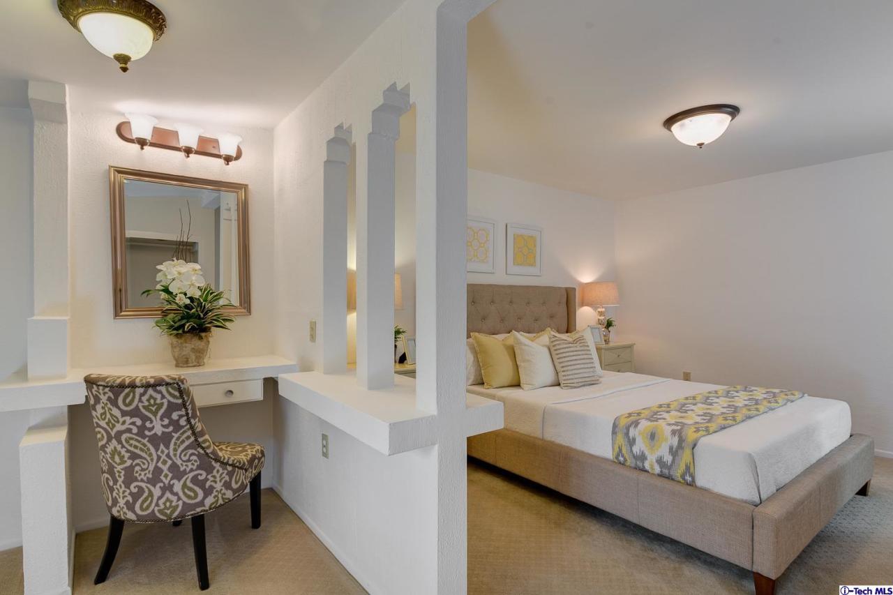 804 Milan Avenue South Pasadena, CA 91030 - Photo 53 of 58 a bedroom with a large bed and a potted plant