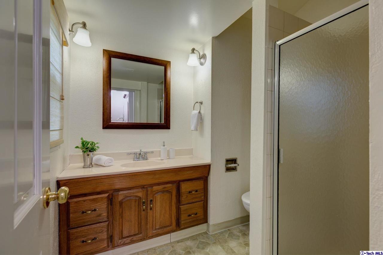 804 Milan Avenue South Pasadena, CA 91030 - Photo 54 of 58 a bathroom with a double vanity sink and a mirror