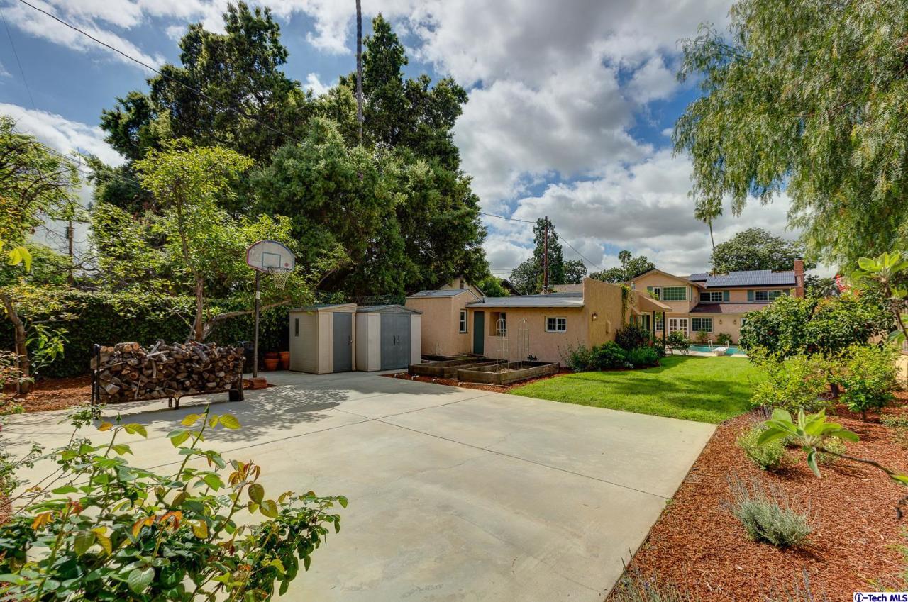 804 Milan Avenue South Pasadena, CA 91030 - Photo 58 of 58 a backyard of a house with table and chairs plants and large trees