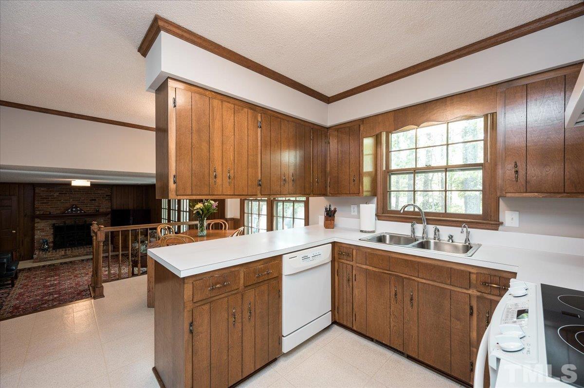 2012 Eagleton Circle Raleigh, NC 27609 - Photo 12 of 29 a kitchen with a sink stove and cabinets