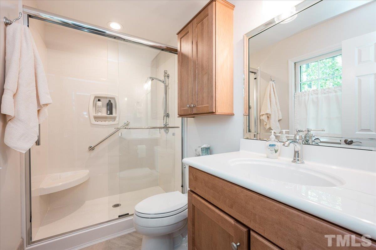 2012 Eagleton Circle Raleigh, NC 27609 - Photo 25 of 29 a bathroom with a sink a toilet and shower