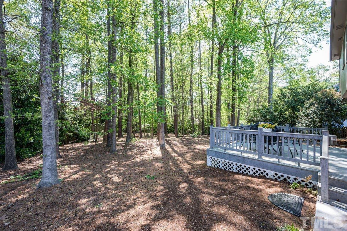 2012 Eagleton Circle Raleigh, NC 27609 - Photo 3 of 29 a view of a deck with a backyard and trees