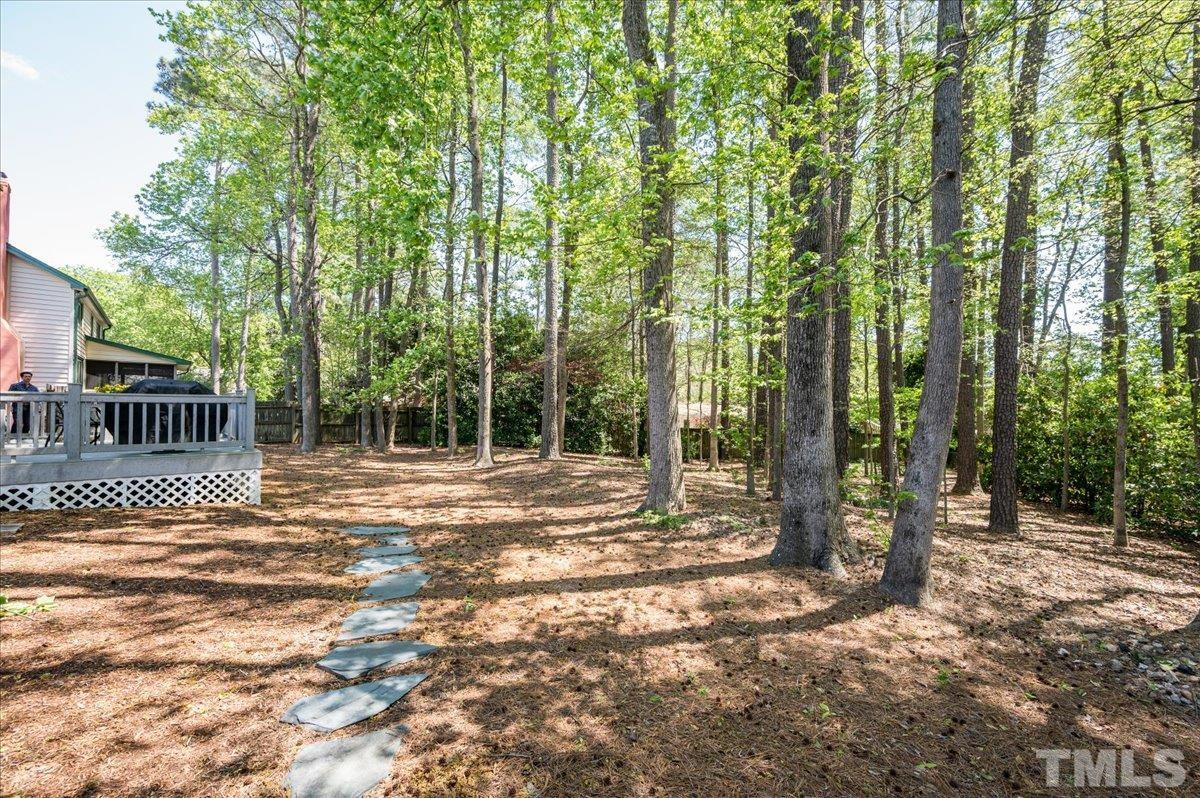 2012 Eagleton Circle Raleigh, NC 27609 - Photo 5 of 29 a view of a house with backyard and trees