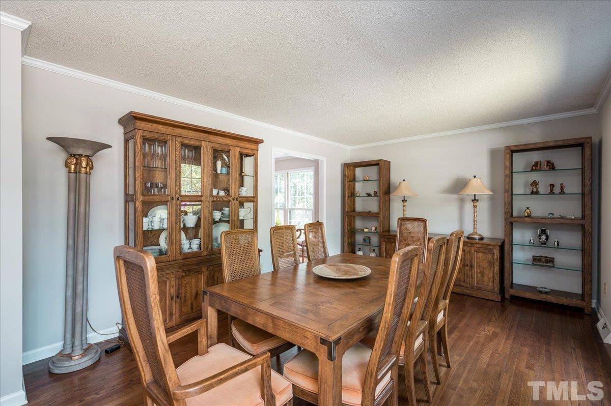 2012 Eagleton Circle Raleigh, NC 27609 - Photo 8 of 29 a view of a dining room with furniture window and wooden floor