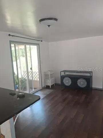 a view of a livingroom with wooden floor