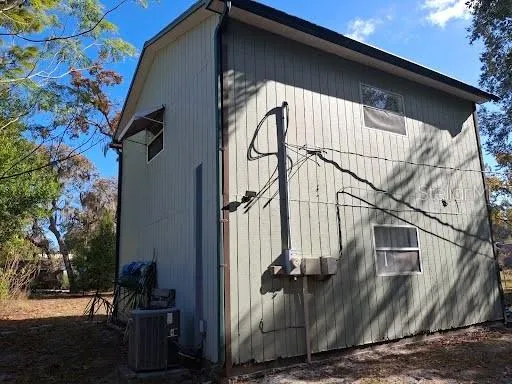 a view of a house with a tree