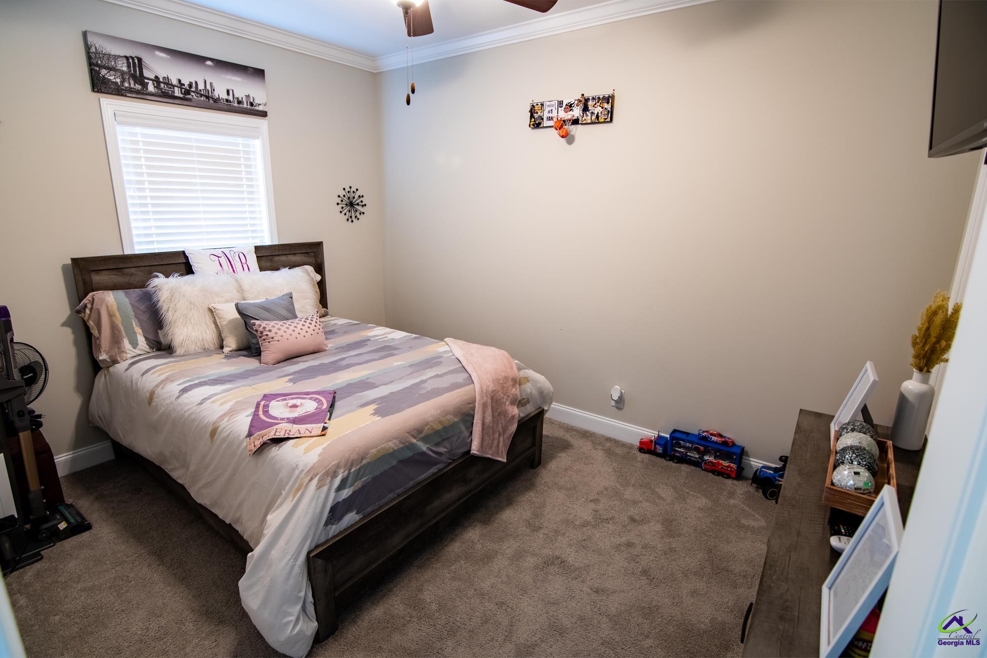 123 Logan's Mill Trail Warner Robins, GA 31093 - Photo 18 of 23 a bedroom with a bed and a window