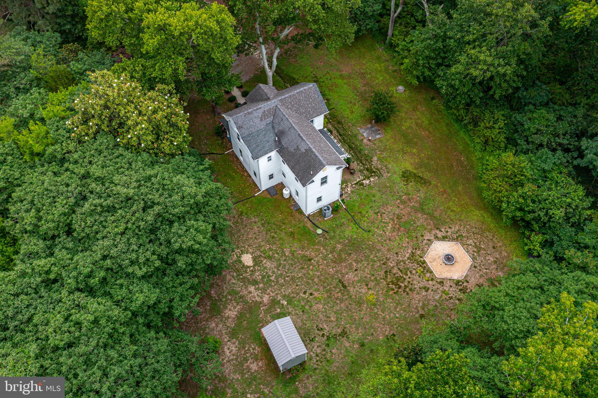 3952 Irvington Road Irvington, VA 22480 - Photo 61 of 77 an aerial view of a house with garden space and street view