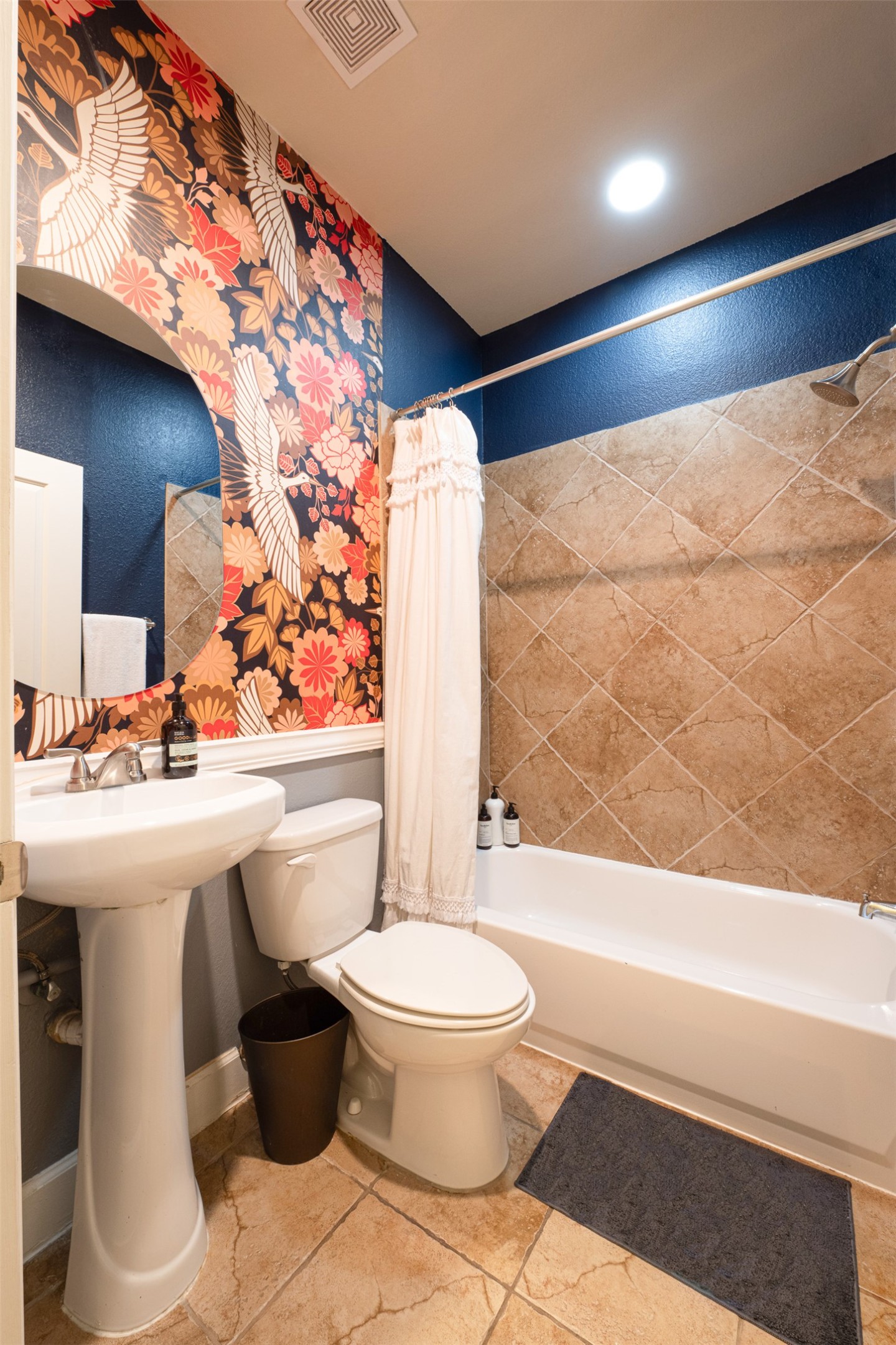 2302 East 9th Street Austin, TX 78702 - Photo 22 of 31 Bold wallpaper and patterned tile elevate this refreshing full bathroom.
