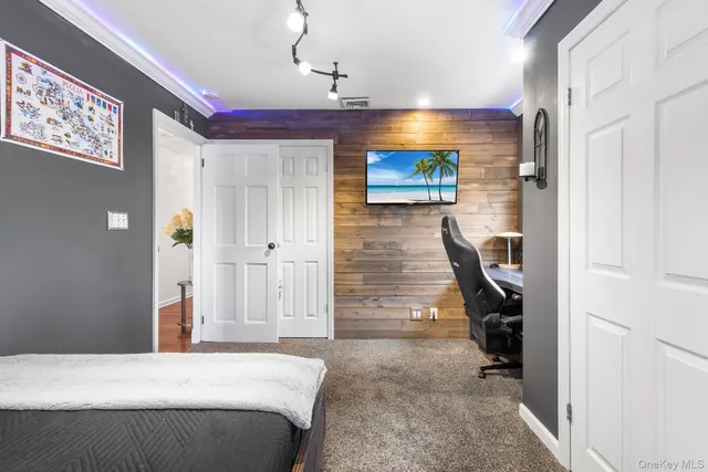 a bedroom with a bed and a view of bathroom