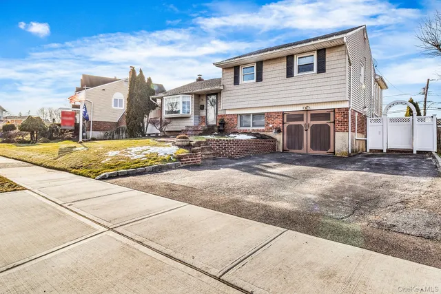 a view of a house with snow on the road