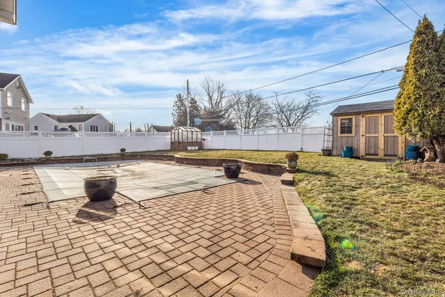 a view of swimming pool with outdoor seating
