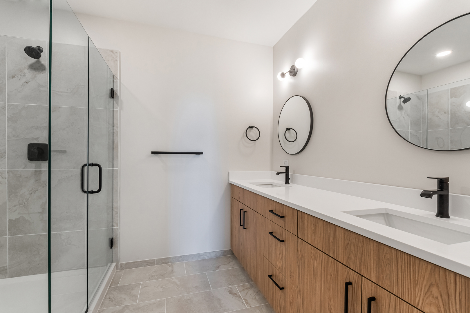 805 North Milwaukee Avenue, Unit 4N Chicago, IL 60642 - Photo 19 of 34 a bathroom with a double vanity sink mirror and shower