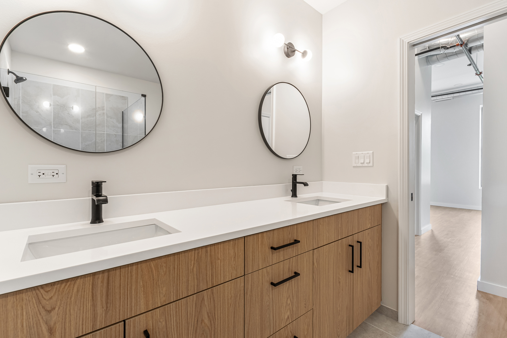 805 North Milwaukee Avenue, Unit 4N Chicago, IL 60642 - Photo 21 of 34 a bathroom with a sink and a mirror