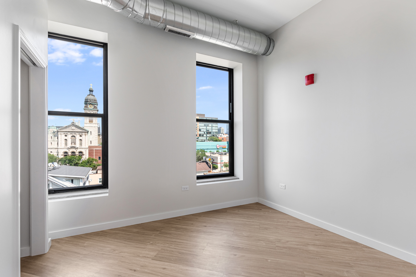 805 North Milwaukee Avenue, Unit 4N Chicago, IL 60642 - Photo 26 of 34 an empty room with windows and closet