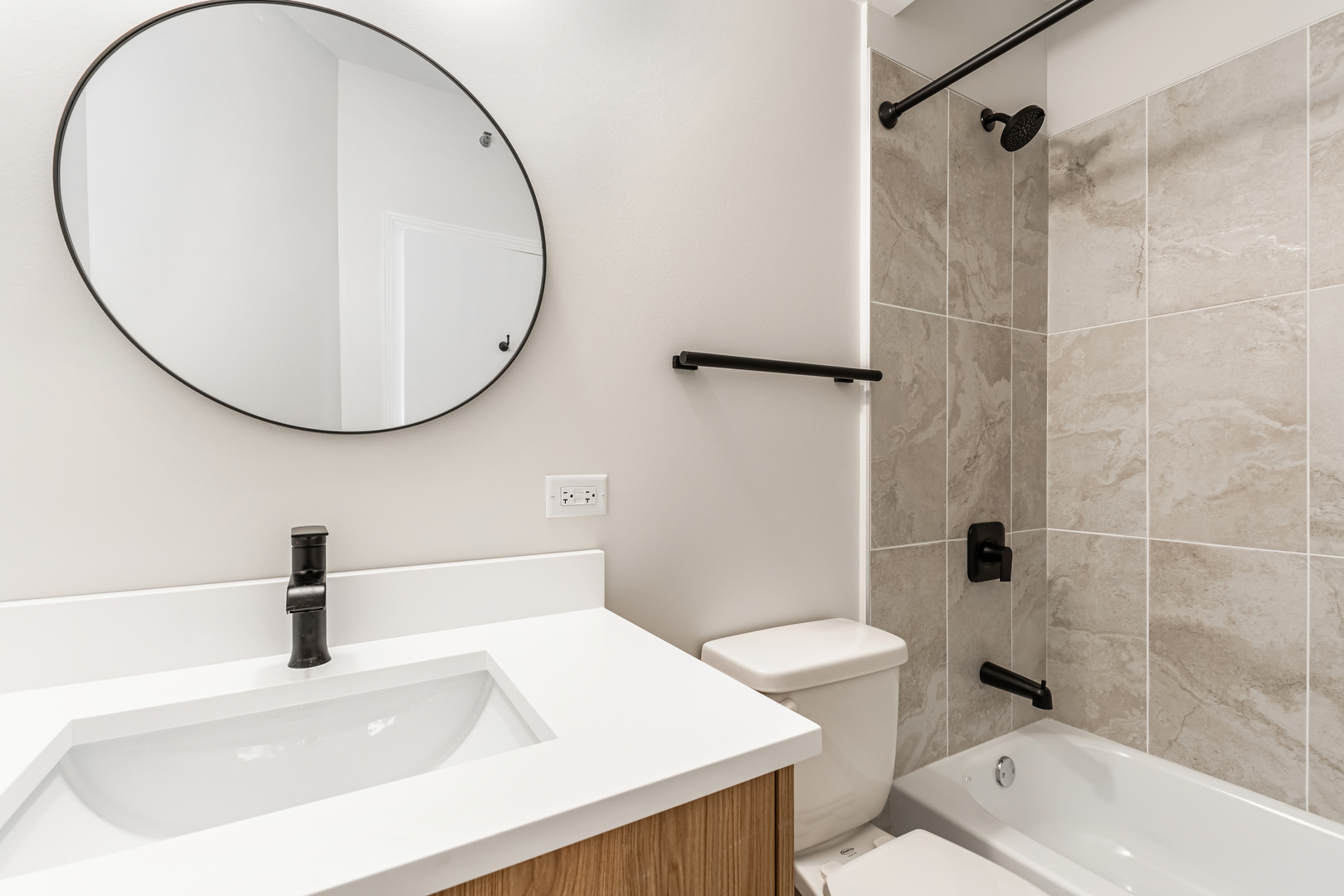 805 North Milwaukee Avenue, Unit 4N Chicago, IL 60642 - Photo 27 of 34 a bathroom with a sink a toilet and a mirror