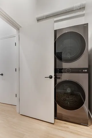a view of a hallway with washer and dryer