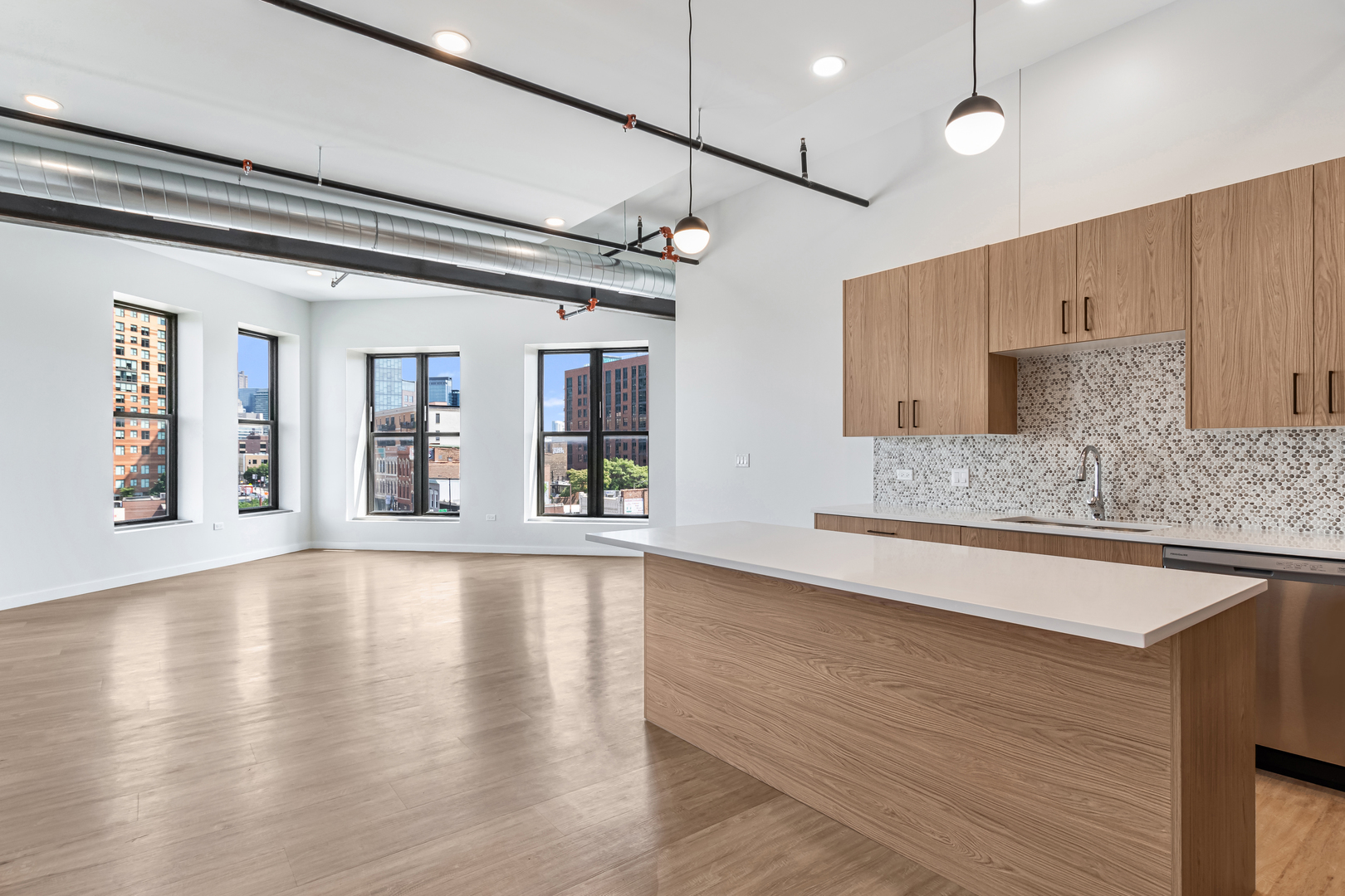 805 North Milwaukee Avenue, Unit 4N Chicago, IL 60642 - Photo 9 of 34 a view of an empty room with window and wooden floor