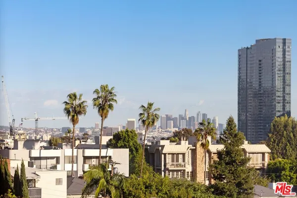 a view of a city with tall buildings