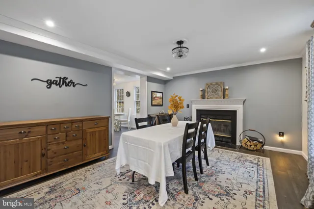 a living room with furniture a dining table and chairs