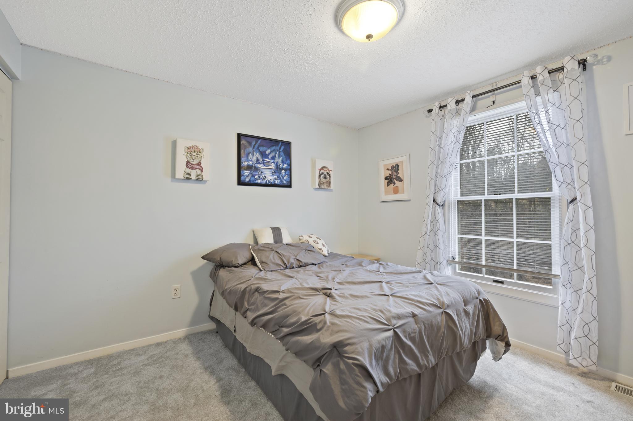 7802 Blue Hill Road Glenville, PA 17329 - Photo 28 of 44 a bedroom with a bed and a window