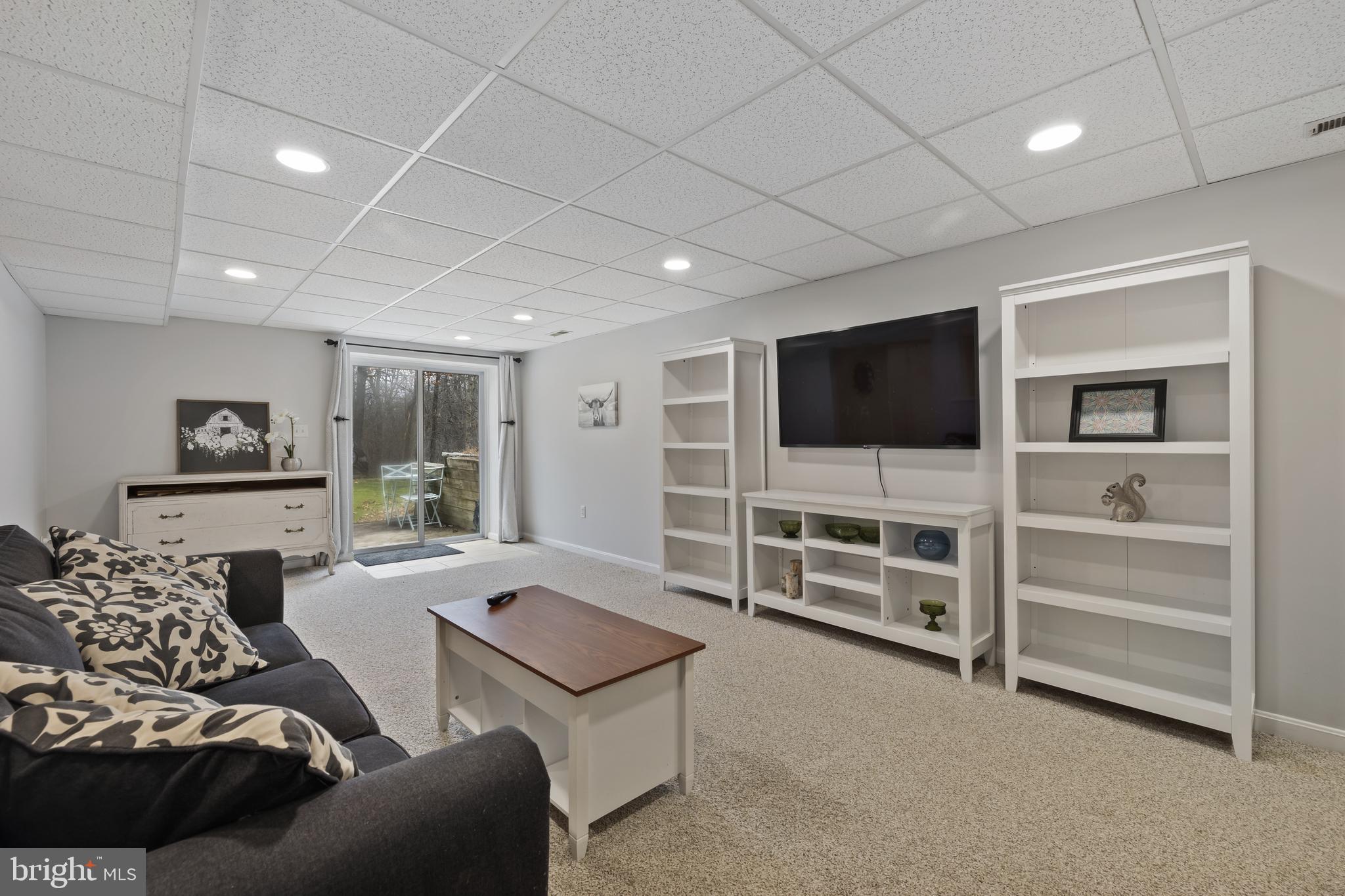 7802 Blue Hill Road Glenville, PA 17329 - Photo 34 of 44 a living room with furniture and a flat screen tv