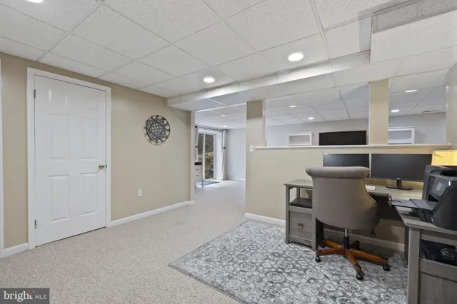 a workspace with a table and chairs