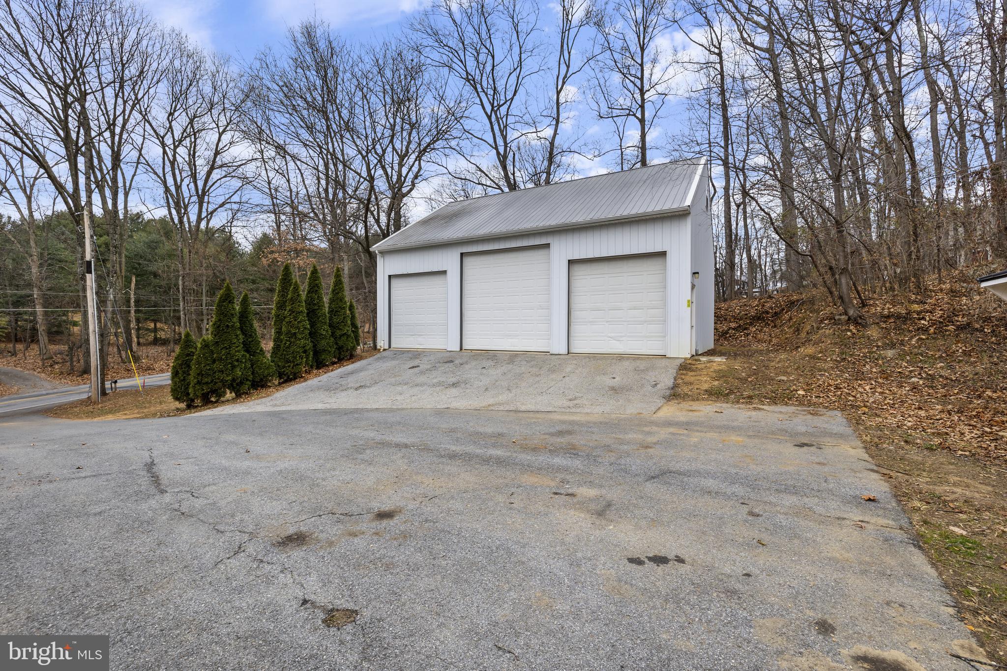 7802 Blue Hill Road Glenville, PA 17329 - Photo 6 of 44 a house with trees in front of it