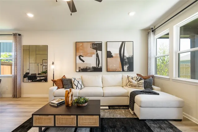 a living room with furniture and a large window