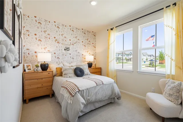 a bedroom with a bed and a couch