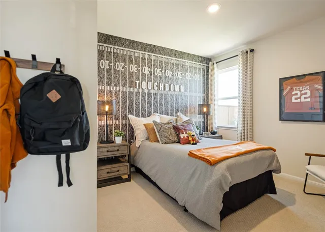 a bedroom with bed and a window