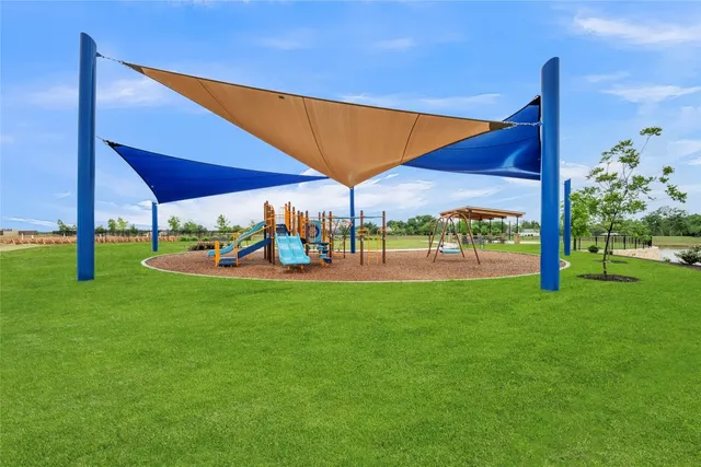 a view of a two chairs and table in the yard