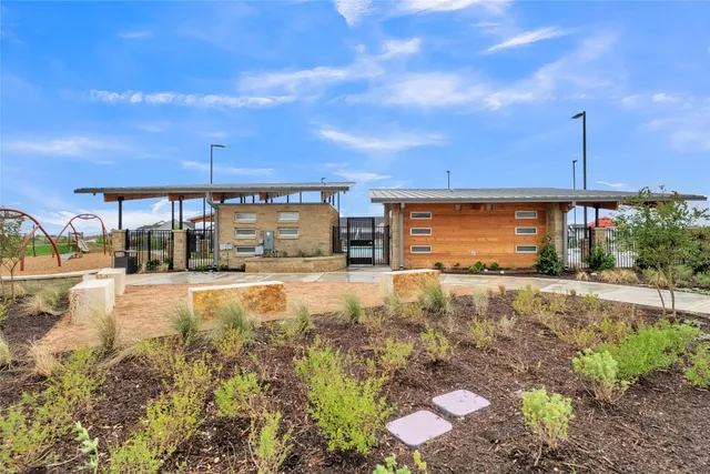 a view of a swimming pool with an outdoor seating
