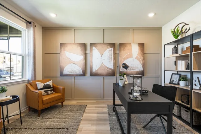 a living room with furniture and a lamp